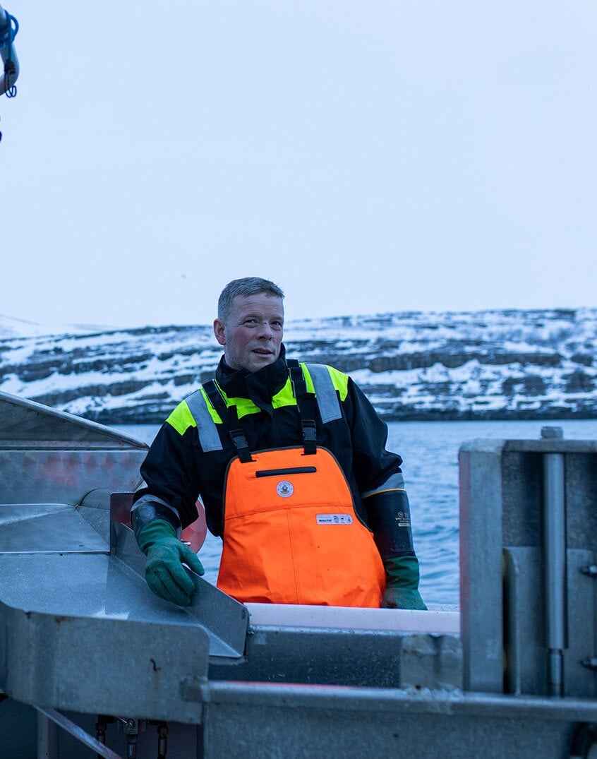 Pêcheur sur un bateau